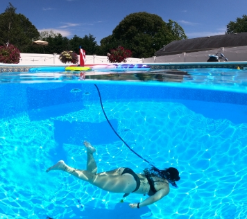 woman using Nemo dive system in pool 