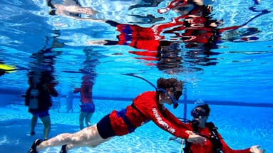 Pool operator instructing a diver using the BLU3 system.