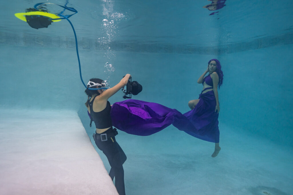 Underwater photographer Kimber from Water Bear Photography using the BLU3 dive system during a fashion photoshoot.