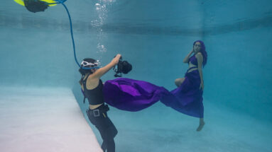 Underwater photographer Kimber from Water Bear Photography using the BLU3 dive system during a fashion photoshoot.