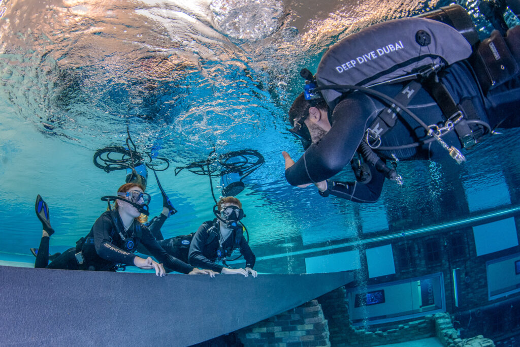 Young divers at Deep Dive Dubai experiencing their first dive with the BLU3 Nomad system.