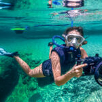 Kimber from Water Bear Photography relying on the BLU3 dive system while documenting the clear springs.