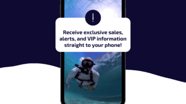 Phone displaying underwater diver with text overlay: 'Receive exclusive sales, alerts, and VIP information straight to your phone!