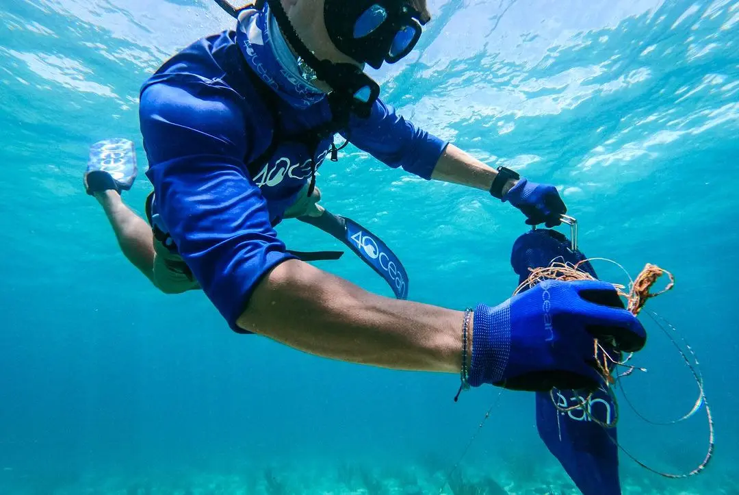 Alex performing an underwater cleanup with Nomad